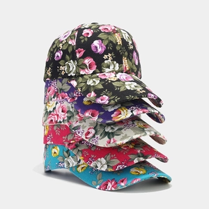 Five assorted floral canvas baseball caps in black, white, pink, blue, and purple