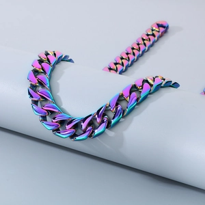 Rainbow-colored 15mm flat Cuban link chain necklace and bracelet set on display
