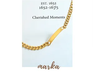 Detail view of gold-plated stainless steel Cuban chain necklace with a rectangle ID plate