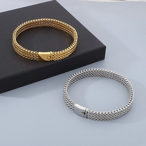 Detailed view of woven metal mesh bracelets in gold and silver with rectangular clasps