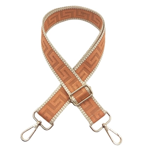Close-up of orange maze jacquard 3.8cm wide strap with adjustable golden metal hardware