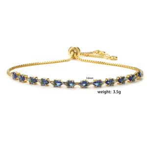Detail showing 3.5g gold-plated adjustable bracelet with 3.6mm blue marquise gems