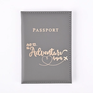 Grey PU leather passport holder with rose gold stamped adventure begins lettering