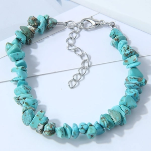 Macro detail of turquoise stone bracelet with silver adjustable lobster clasp closure