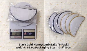 Detail view of 6 black gold honeycomb balls decorations showing size and weight measurement