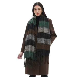 Winter striped knit scarf with fringes and shimmering threads on a fashion model