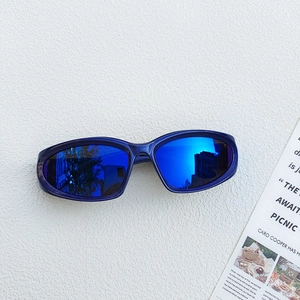 Top view of blue matte kids sports sunglasses with retro oval mirrored lenses