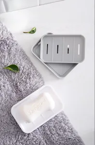 Detail of minimalist double-layer drainage soap box with white and grey matte finish