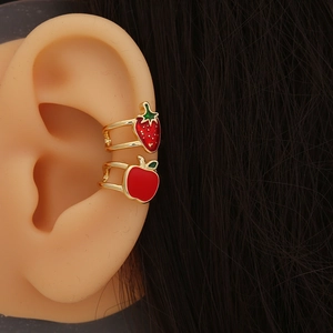 Cute strawberry and apple ear cuffs in red enamel and gold finish on silicone ear model