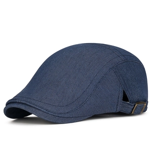 Navy blue denim newsboy cap for men and women with adjustable brass buckle side detail
