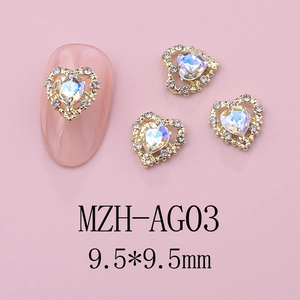 Macro detail of heart nail art charms with 9.5mm gold metal base and sparkling crystal gems