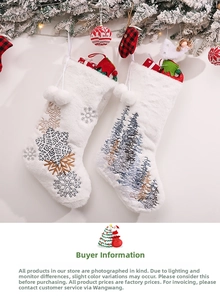 Detailed view of white plush Christmas stockings with silver snowflake and pine tree embroidery