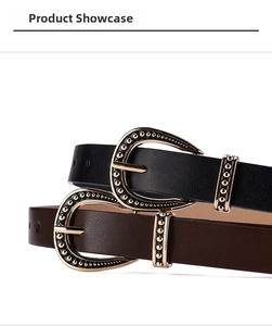 Detail of vintage leather belts in black and brown with horseshoe buckles and gold studs
