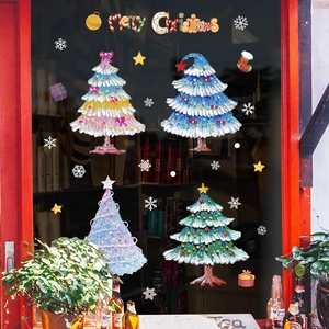 Kit stickers Joyeux Noël colorés avec quatre sapins festifs sur fenêtre en verre