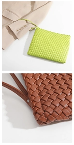Close-up of premium woven leather texture and metal rivet detail on elegant evening bag