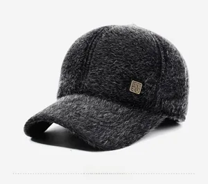 Detail view of winter baseball cap with plush fur texture and side metal badge