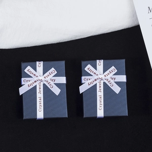 Dark blue jewelry gift boxes with white printed ribbons for necklaces and rings