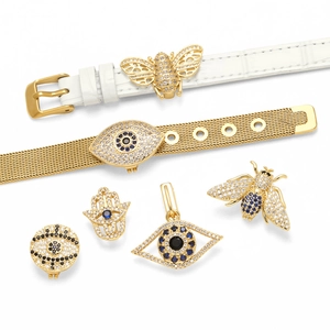 Leather watch band with evil eye and bee charms in gold-plated stainless steel