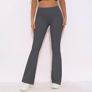 Close-up of high-waisted dark grey flared yoga pants with elastic slimming compression fit