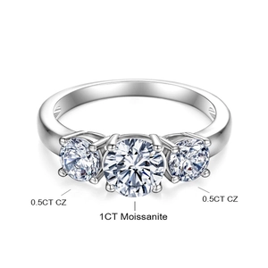 Detail of classic three-stone ring with 1ct moissanite and 0.5ct side cz stones