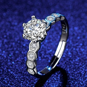 Macro view of S925 silver six-claw moissanite ring with honeycomb band detailing