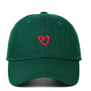 Dark green baseball cap with red heart embroidery and cotton twill texture