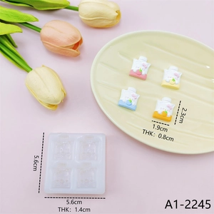 Close-up of cute cartoon drink-shaped resin pieces and silicone mold with dimensions
