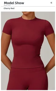 Detailed view of cherry red quick-dry yoga top and leggings on a fitness model