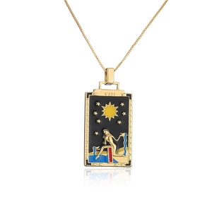 Detailed macro of 18K gold plated Tarot Star pendant with black and blue enamel