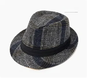 Detail of navy plaid fedora hat with a black ribbon band and vintage tweed texture