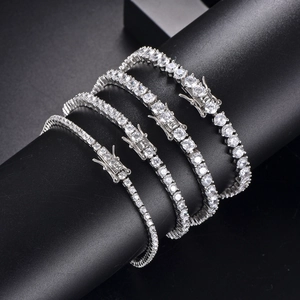 Detailed close-up of various sizes of silver tennis bracelets with cubic zirconia stones