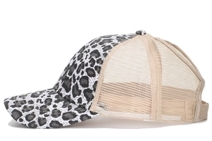 Detailed side view of leopard print baseball cap with khaki breathable mesh backing