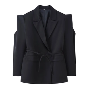 Detail of black blazer featuring unique shoulder cut-outs and a waist tie-up belt