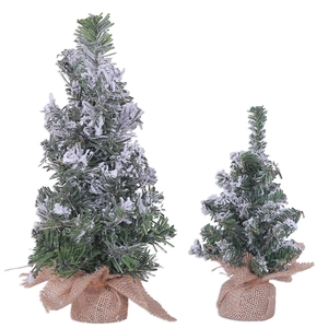 Miniature snow-covered artificial Christmas trees with rustic burlap bases in two sizes