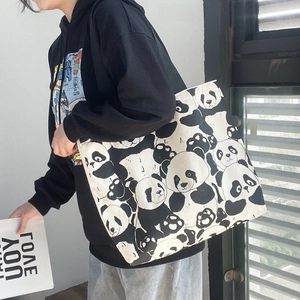Close-up of cute panda print on large capacity canvas tote bag with zipper