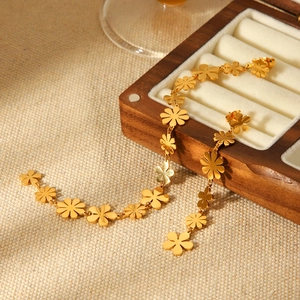 Elegant 18K gold-plated stainless steel daisy long earrings on a premium jewelry box