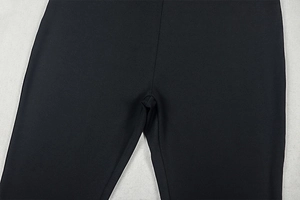 Detailed close-up showing the reinforced crotch stitching and black knit fabric texture