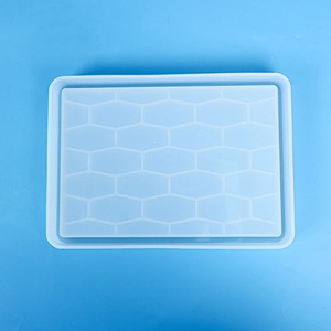 Detail of translucent rectangular silicone tray mold with textured honeycomb pattern