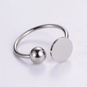 Minimalist stainless steel open ring featuring a polished metal ball and a flat round disc
