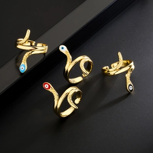 Set of four 18K gold plated snake rings with colorful enamel devil eyes and open bands
