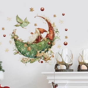 Detailed view of Santa on a green moon wall sticker with golden deer and stars