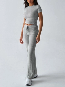 Close-up of grey casual two-piece set with slim crew neck top and flared drawstring pants