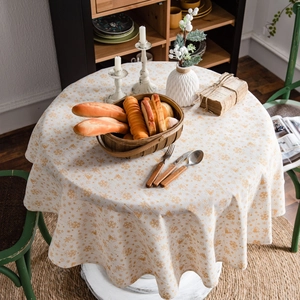 Round Christmas tablecloth with golden snowflake patterns for elegant holiday dining decor