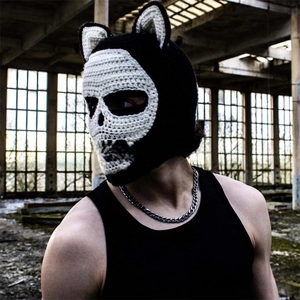 Detail of handmade crochet skull balaclava with cat ears in black and white knit
