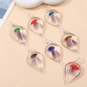 Translucent teardrop glass pendants with colorful miniature mushroom inclusions