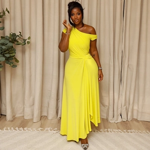 Detail of waist knot and pleated drapes on this one-shoulder yellow maxi dress