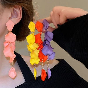 Close-up of matte acrylic rose petal tassel earrings in various vibrant colors