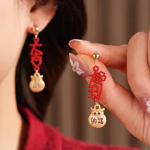 Vintage red enamel lucky bag earrings with gold tassels and Chinese calligraphy