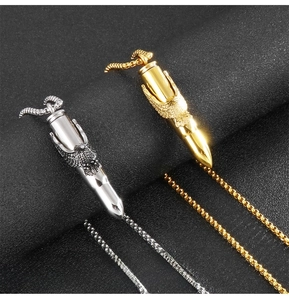Detail showing solid stainless steel eagle bullet pendants with extended tail clasp