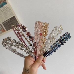 Macro detail of hand-woven luxury crystal headbands with vintage baroque style beads